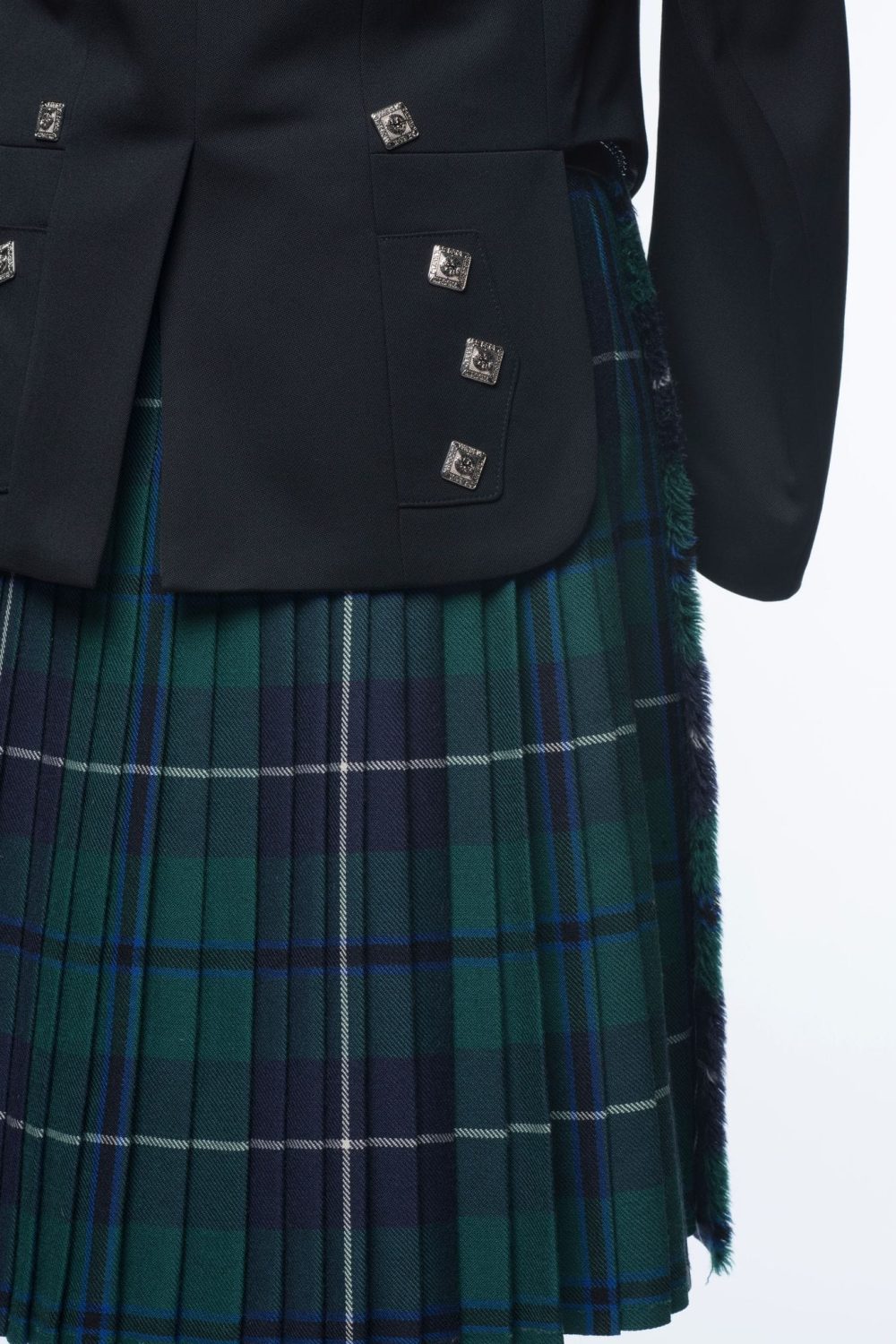 A closeup photo of A Prince Charlie Kilt Outfit.