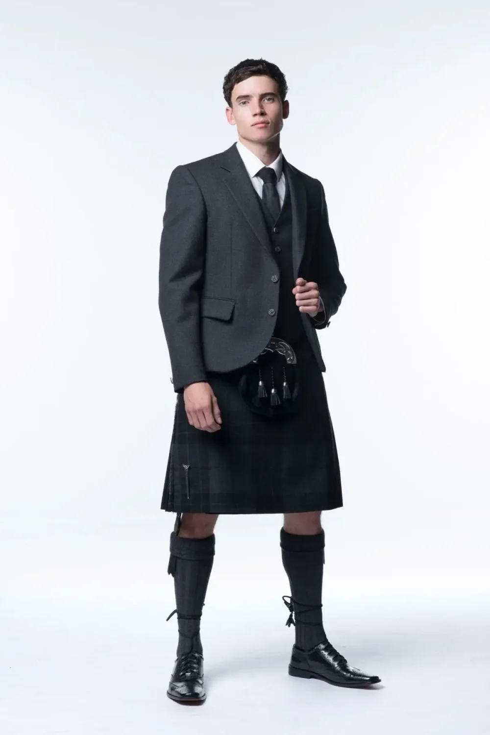 A man wearing Tweed Kilt outfit.